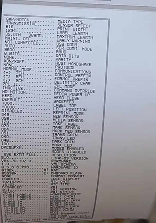 The printed configuration label lists current network and printer settings.