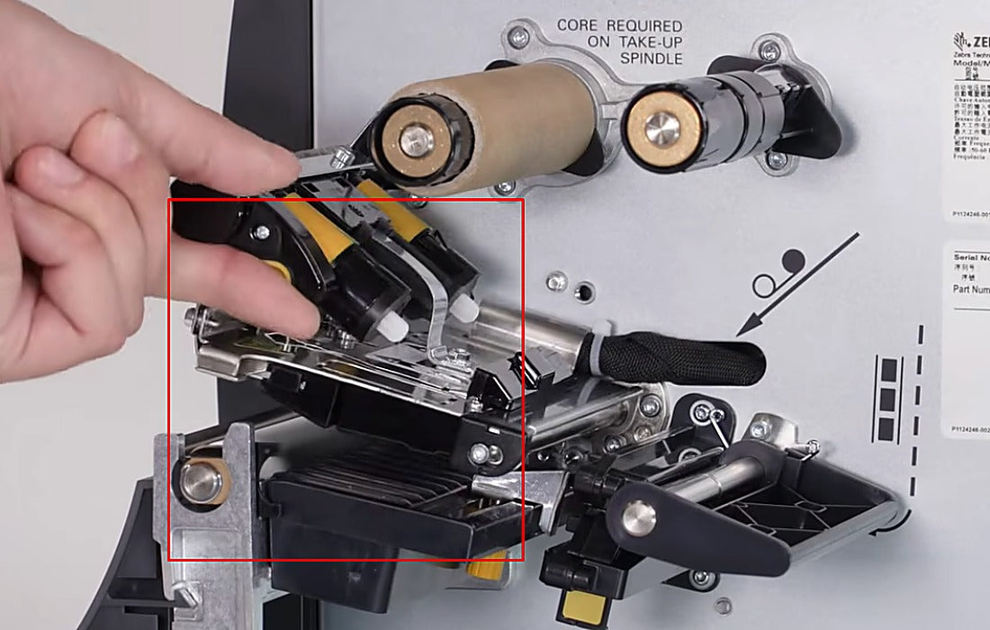 Lift the printhead assembly to access the ribbon path.