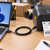 USB cable connecting a Zebra label printer to a laptop